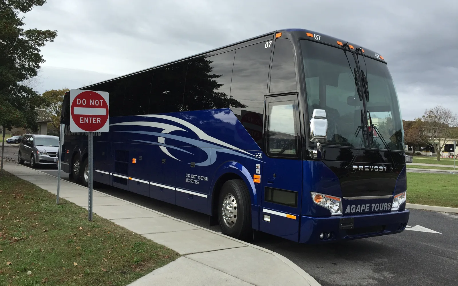 Agape Travel And Tours bus, front corner view